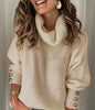 Lange dames coltrui pullover met knoopjes op de mouwen