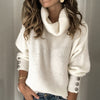 Lange dames coltrui pullover met knoopjes op de mouwen