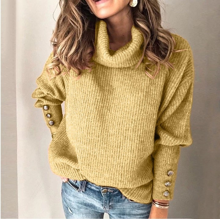 Lange dames coltrui pullover met knoopjes op de mouwen