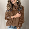 Lange dames coltrui pullover met knoopjes op de mouwen