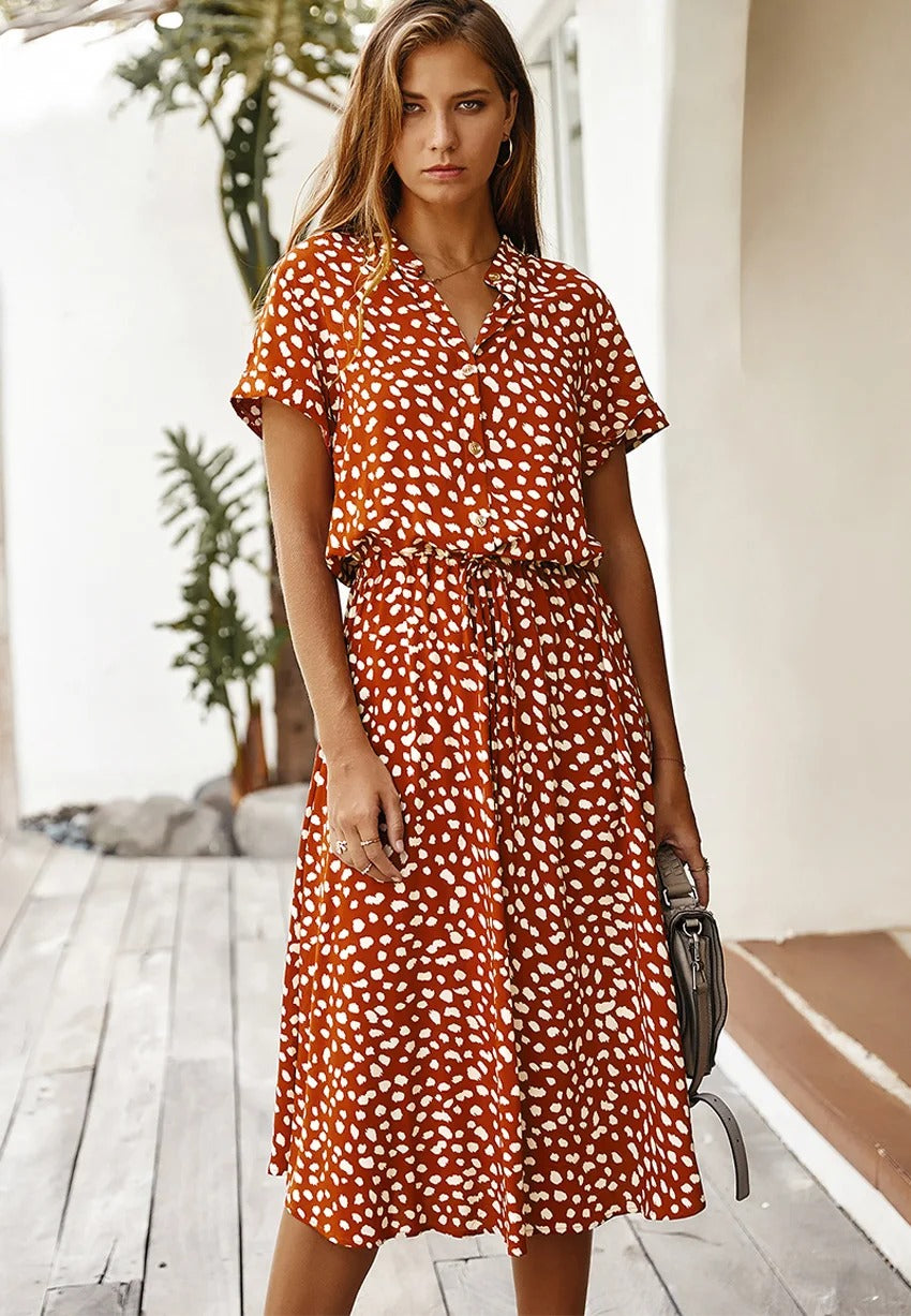 Zomerse midi-jurk met frisse print en korte mouwen