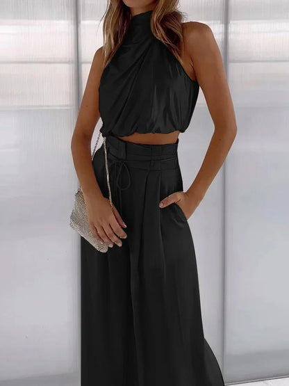Modieuze Damesoutfit: Mouwloze Crop Top en Wijde Broek